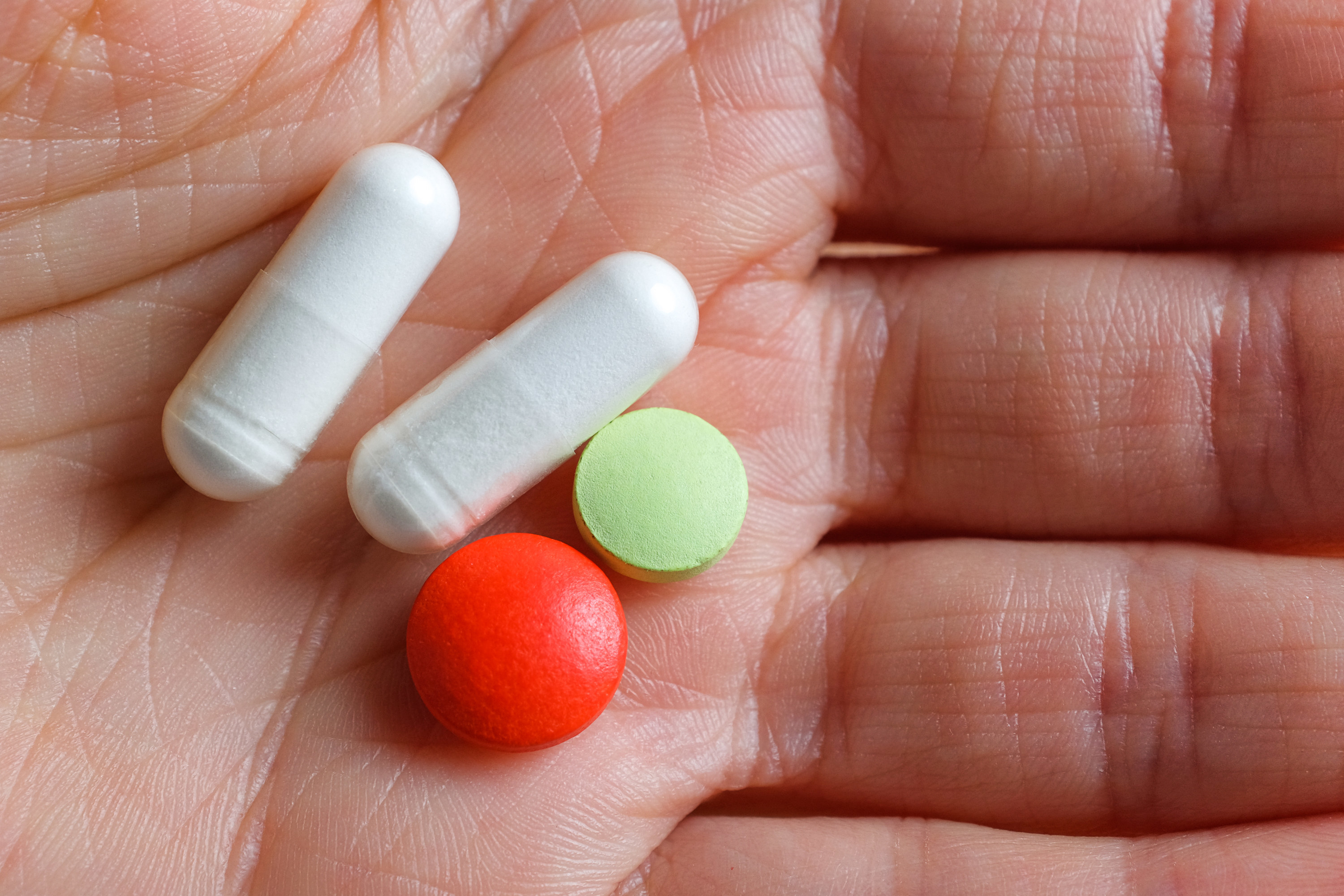 a person holding medication in their hands