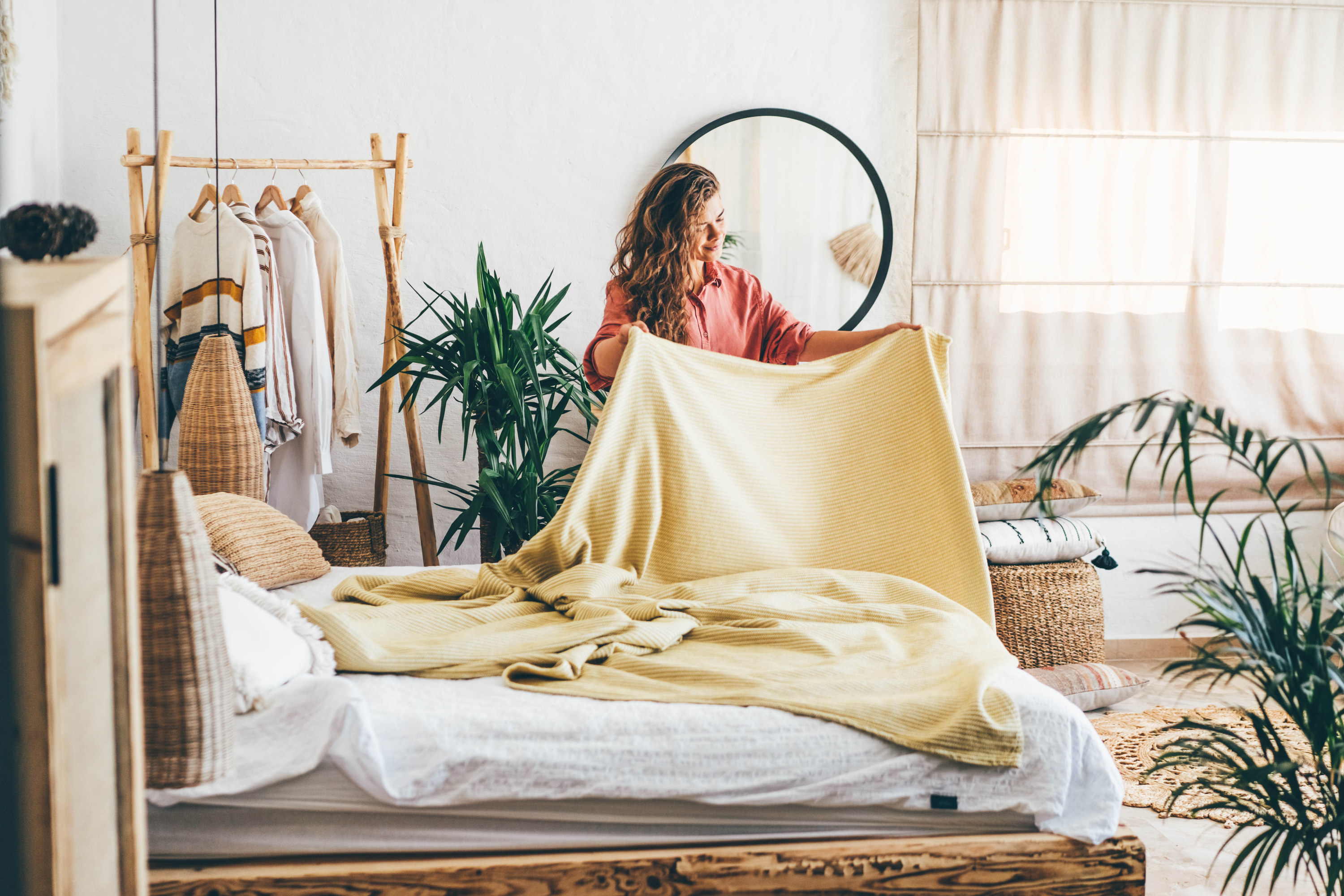 a person making their bed