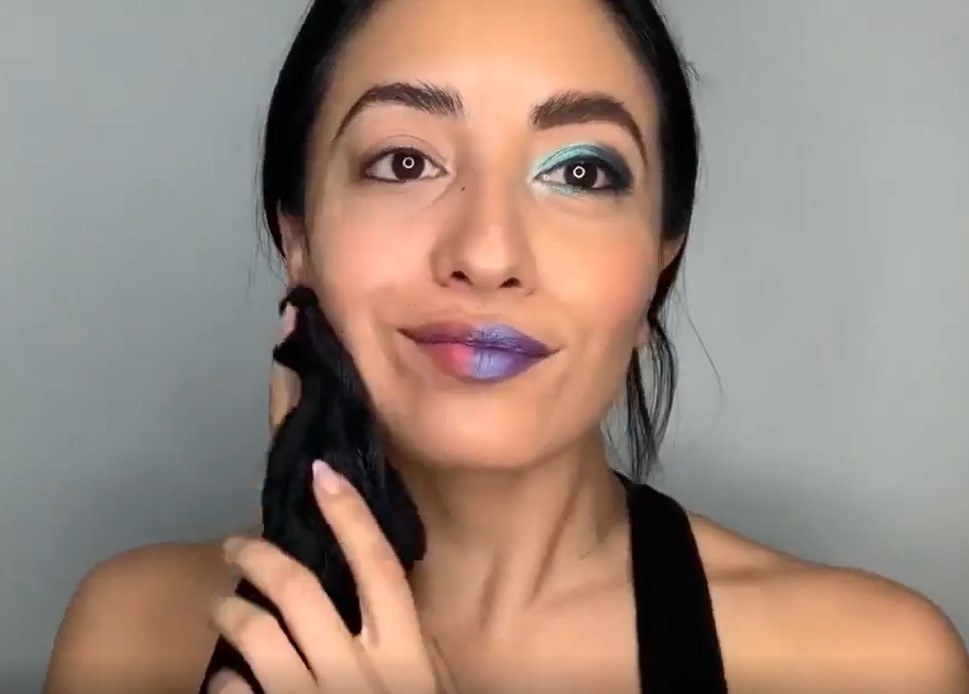 A model using the MakeUp Eraser to remove a full face of makeup