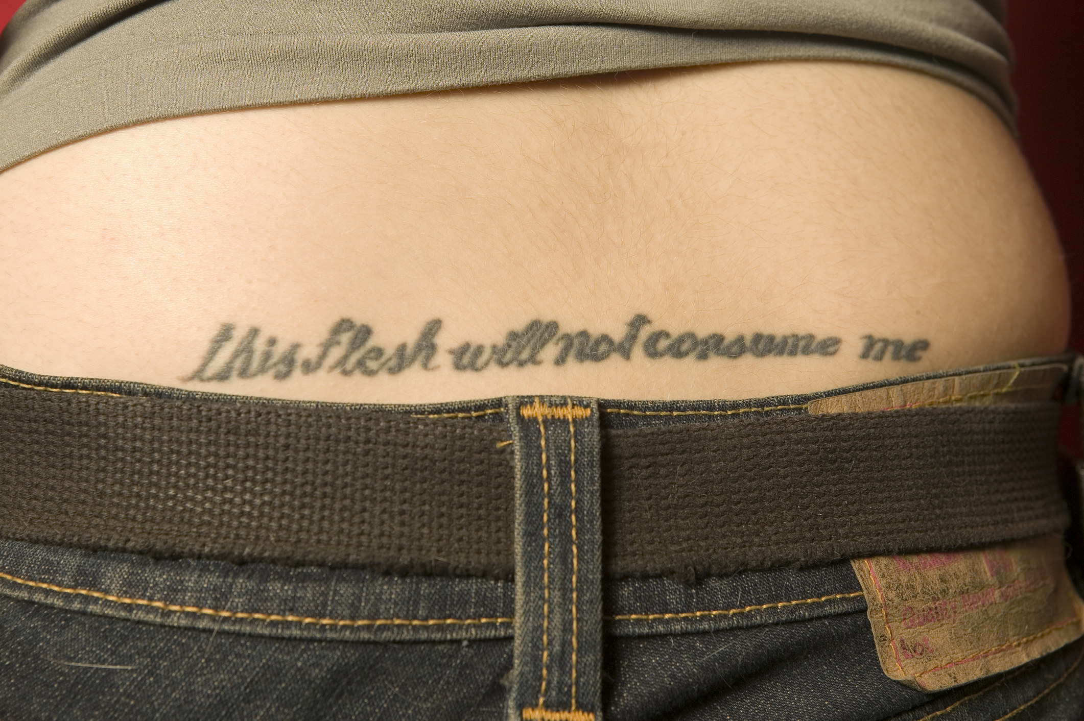A tattoo saying, &quot;this flesh will not consume me&quot;