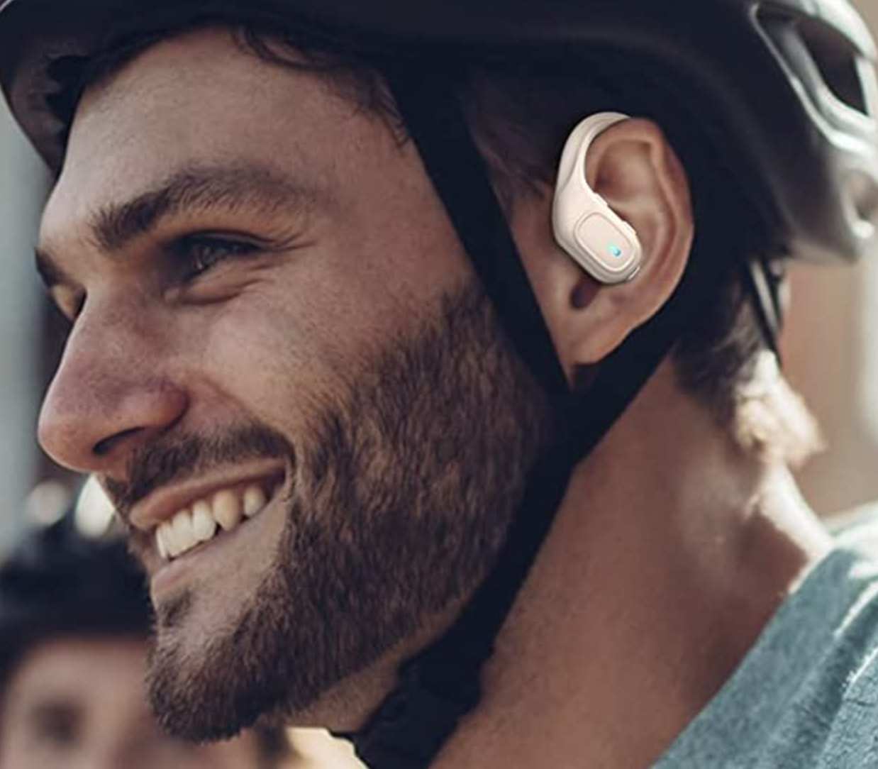 a person riding a bike wearing the earbuds
