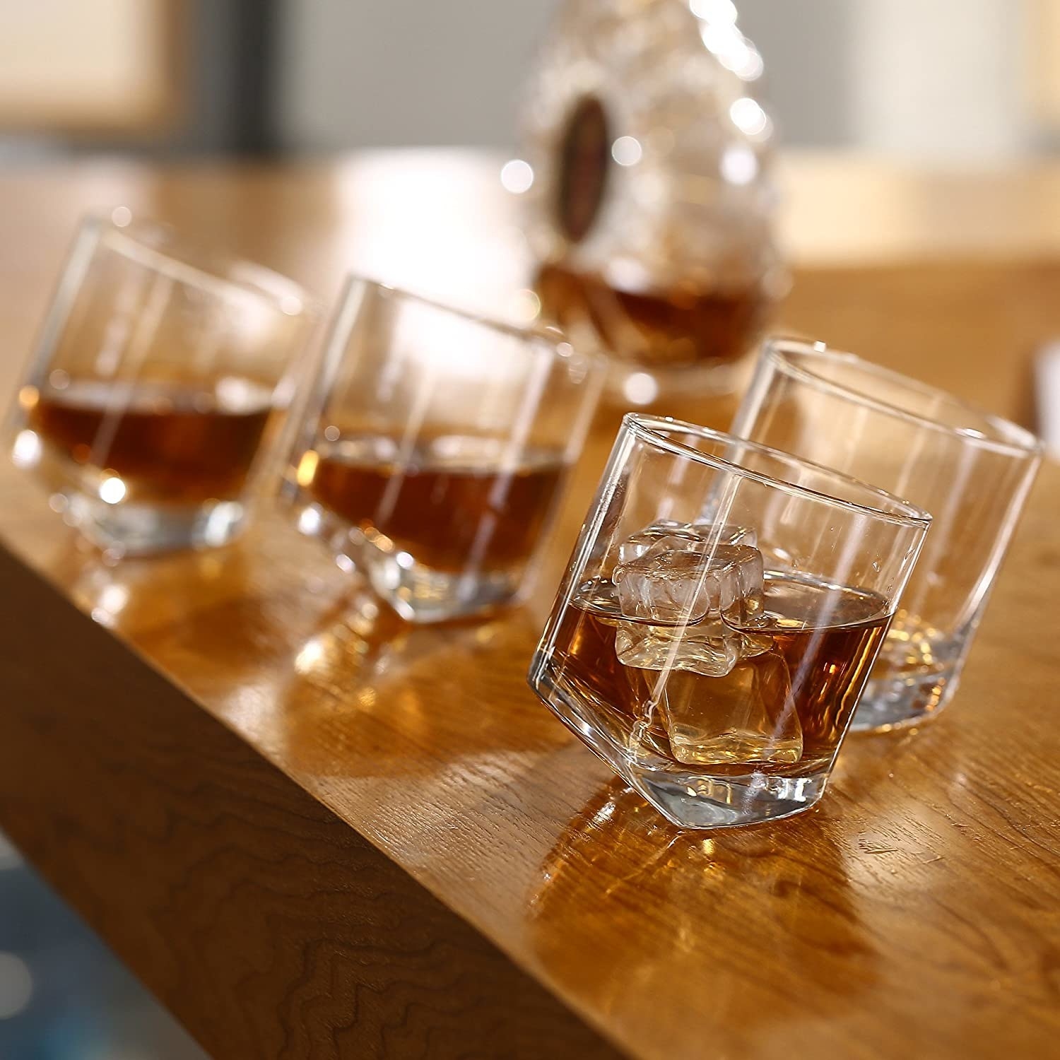 a set of tilting whiskey glasses
