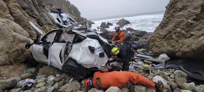 Sheriff&#x27;s inspectors are at a cliffside where a destroyed Tesla car sits between bluffs