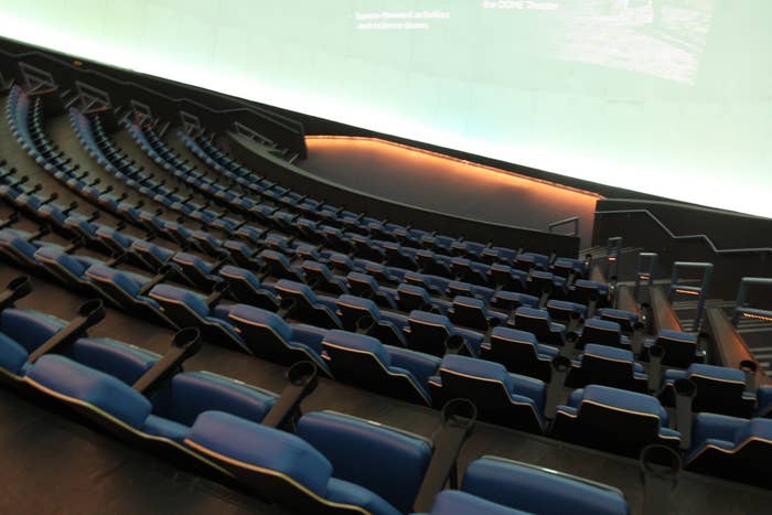 An IMAX theatre with empty seats