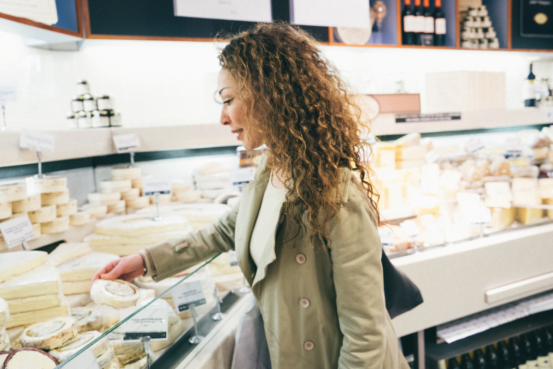 person shopping for cheese