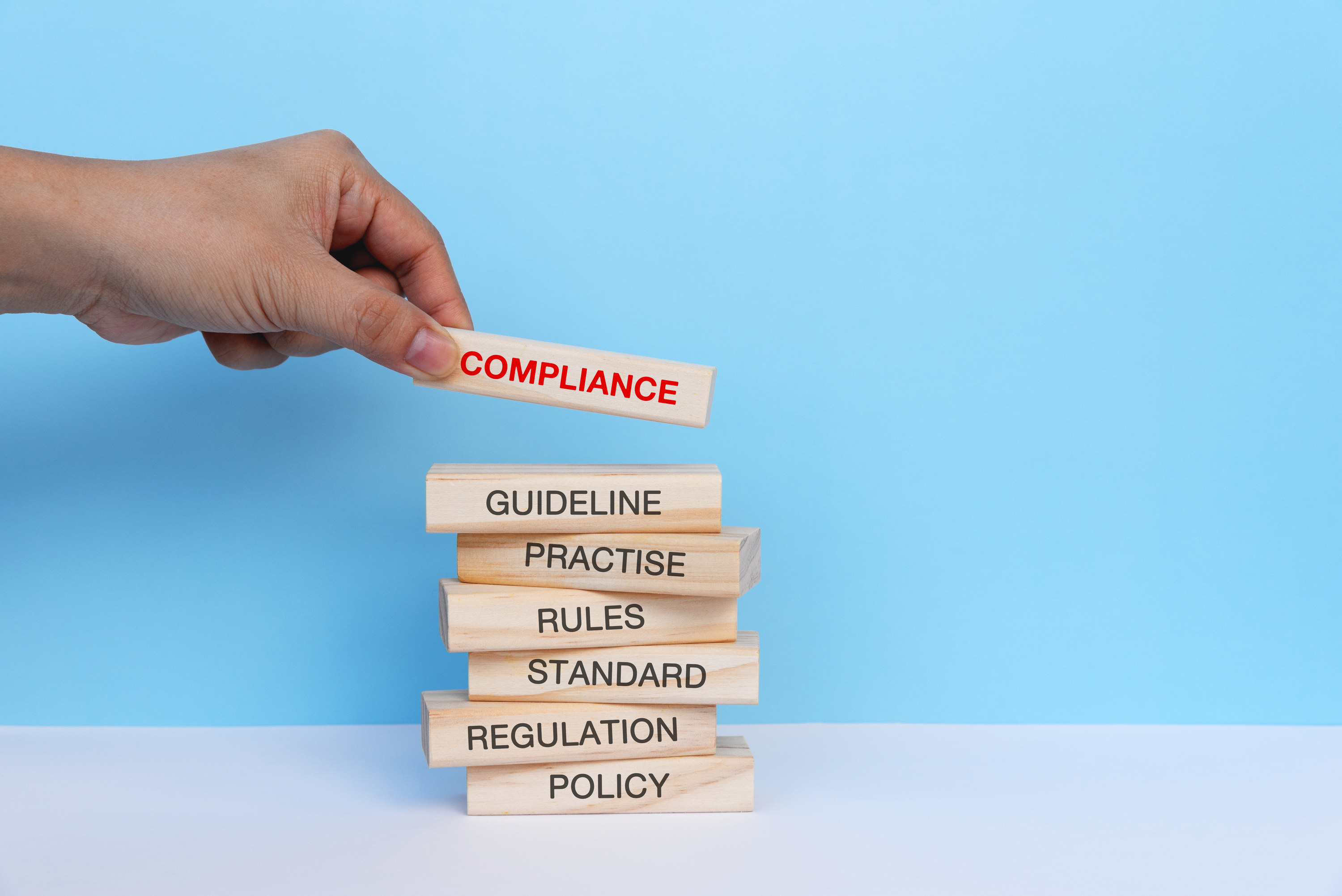 Building blocks with &quot;compliance&quot; at the top