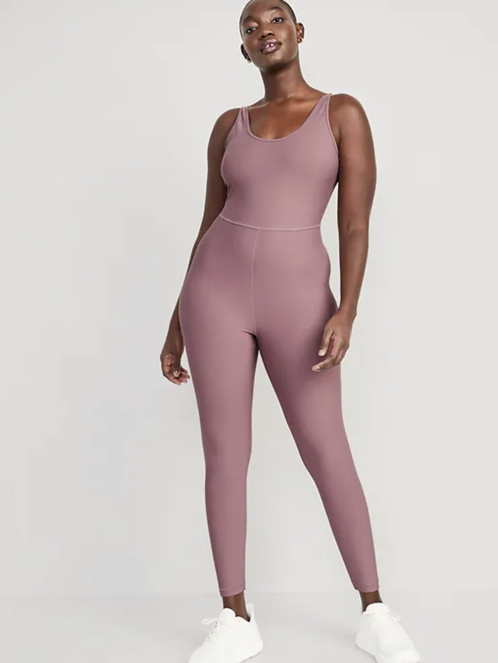 a person wearing the bodysuit in front of a plain background