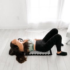 A reviewer laying on the mat
