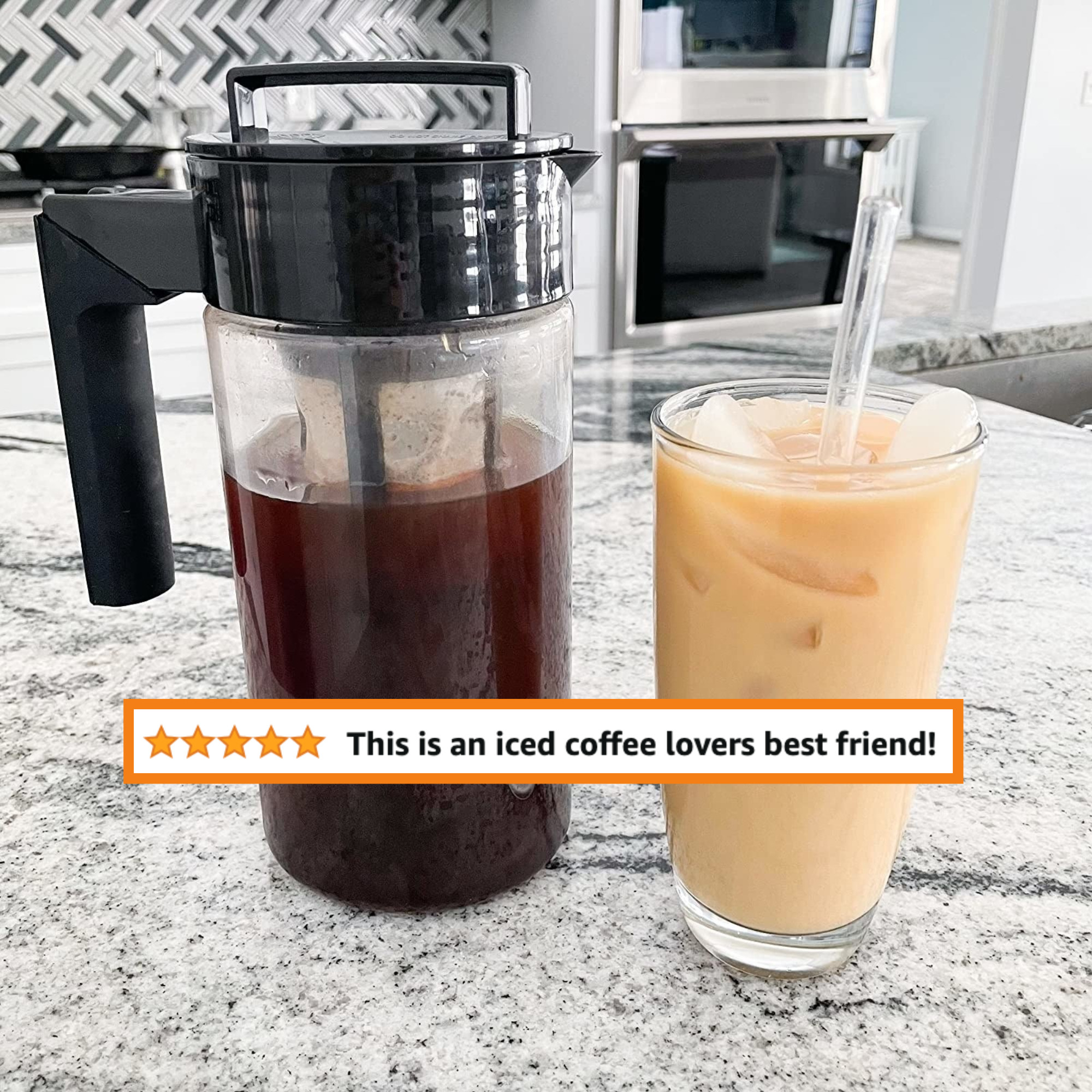 A reviewer&#x27;s cold-brew maker filled with coffee next to a cup of coffee with a lot of cream &quot;this is an iced coffee lovers best friend&quot;