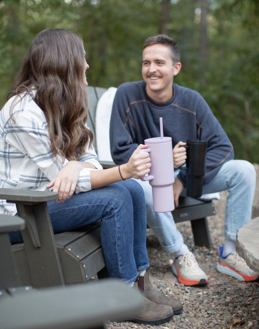 two people with their simple modern tumblers sitting on outdoor chairs