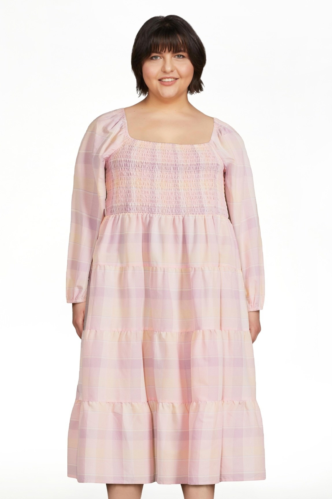 Model wearing pink, peach and yellow dress