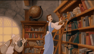 Belle from Beauty and the Beast swinging on a ladder in a book shop