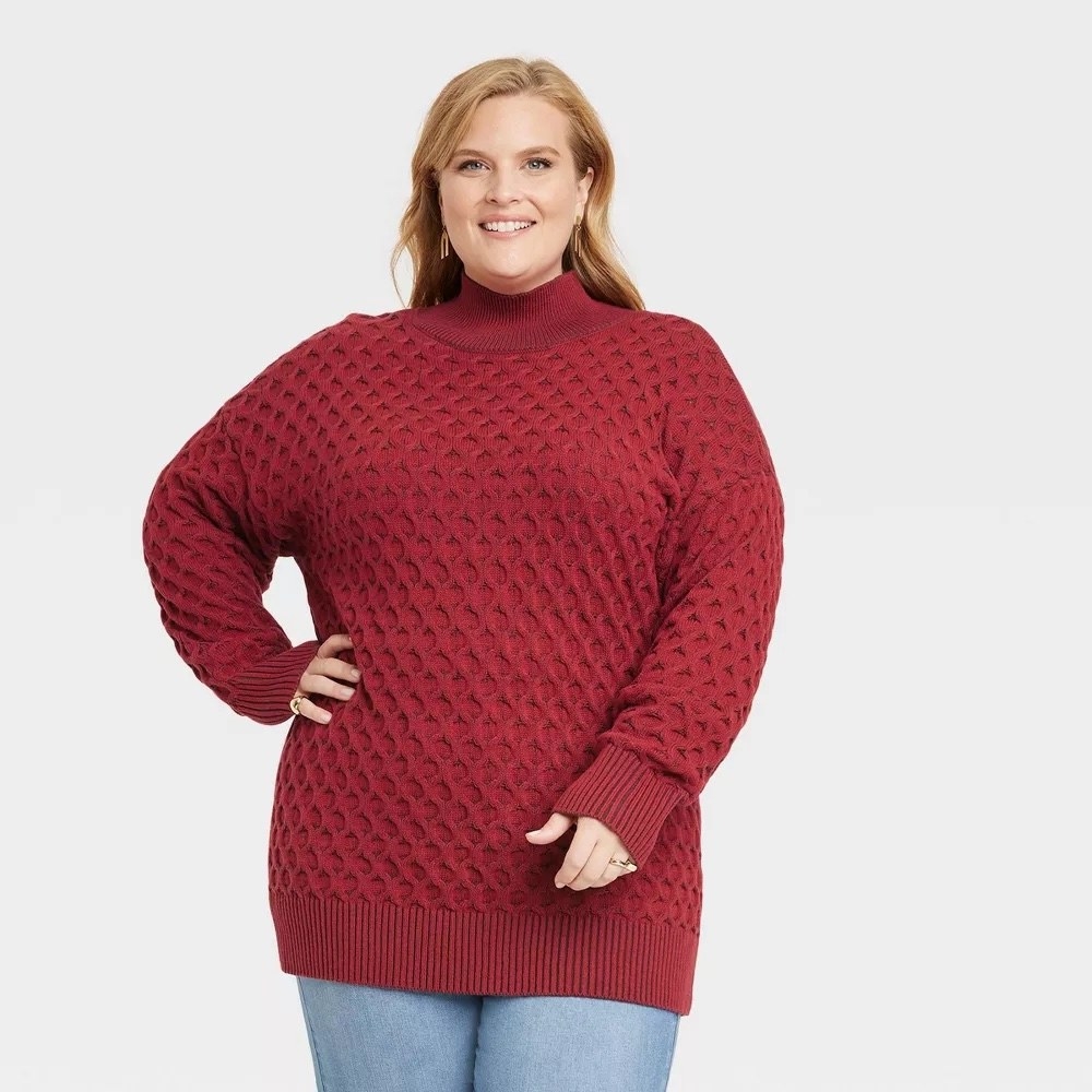 model in the red honeycomb textured sweater