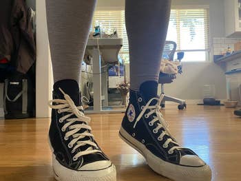 reviewer's photo of the stretchy laces on their sneakers
