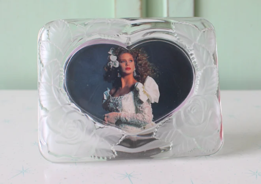 Glass frame with photo of bride in it