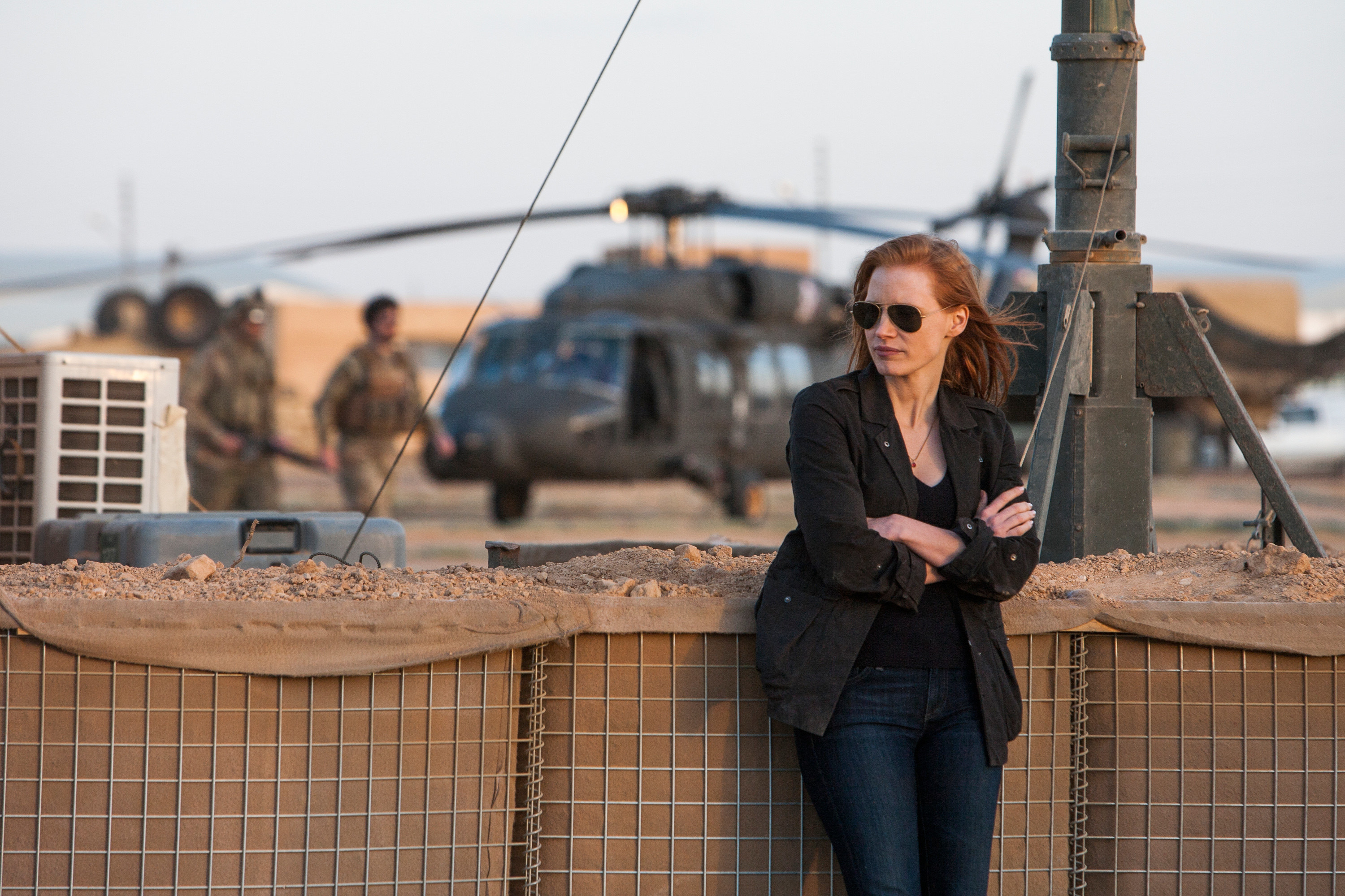 Jessica Chastain stands at a military base