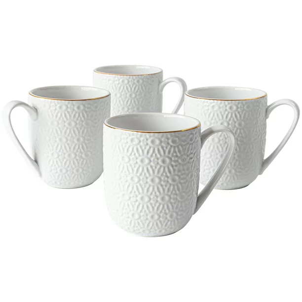 A set of four white ceramic coffee mugs