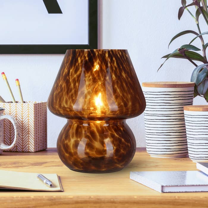 The mushroom lamp on a desk in brown