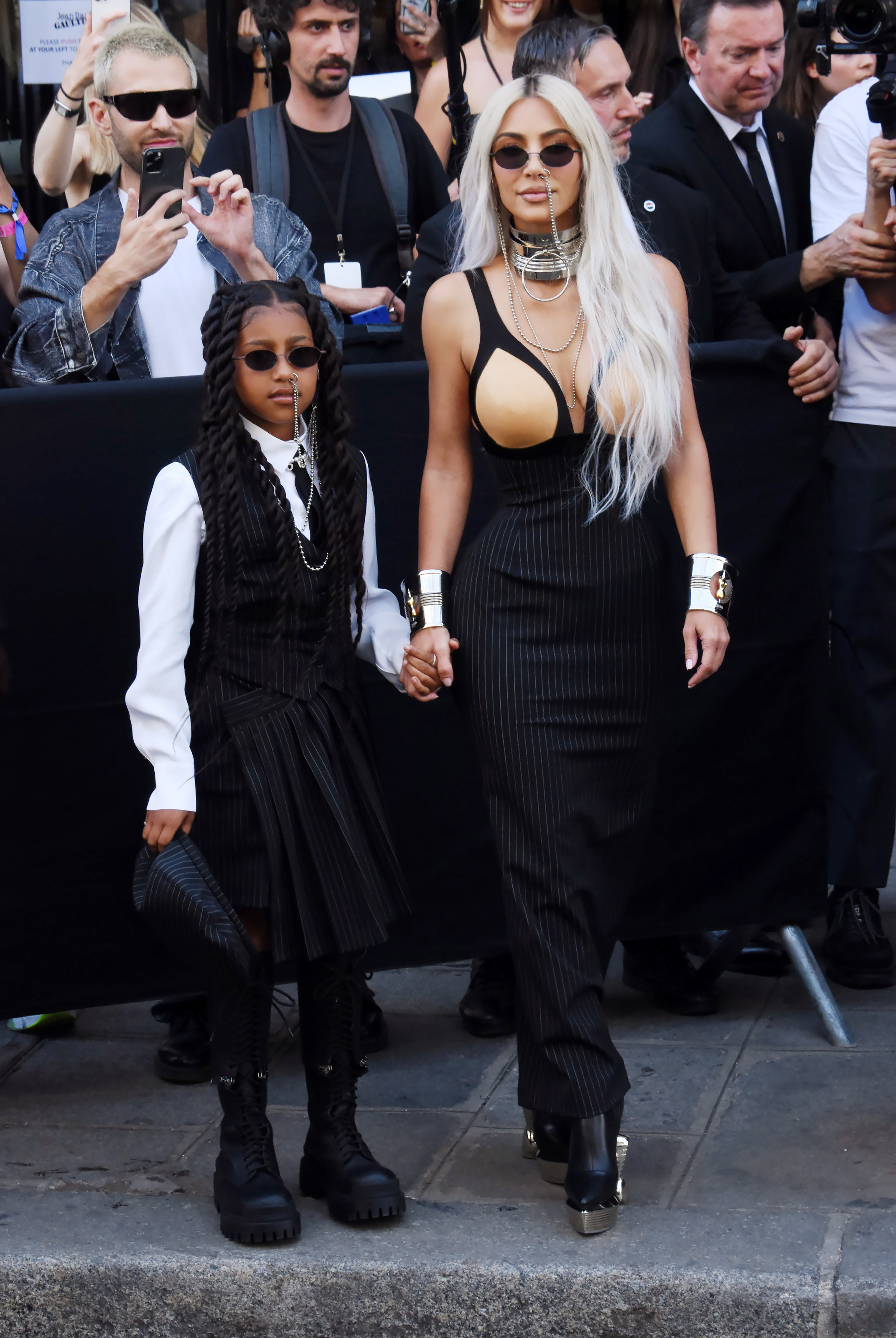 North West and Kim Kardashian posing in m atching looks at paris fashion week