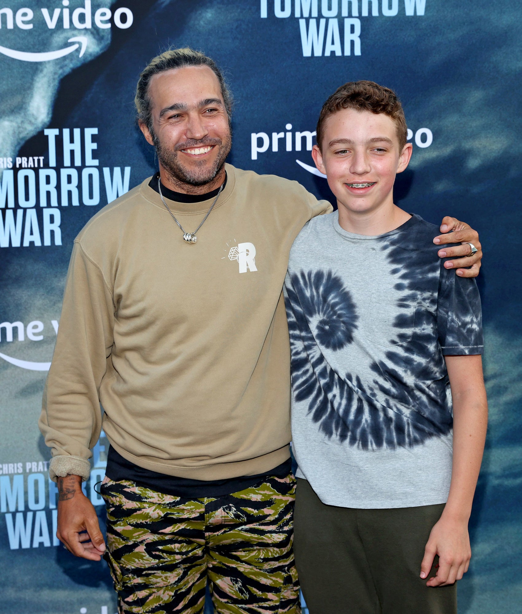 Pete Wentz and Bronz Wentz pose at The Tomorrow War Event