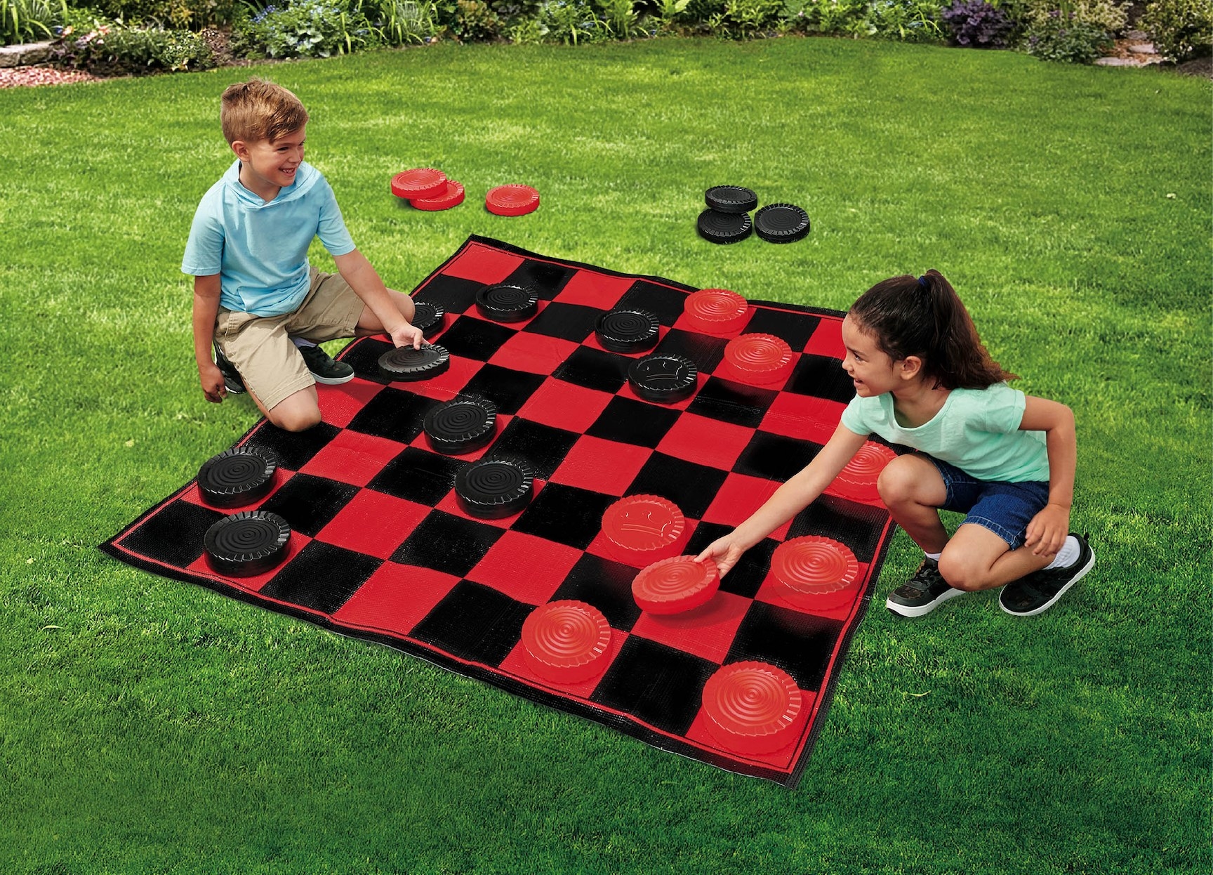 Two kids playing checkers outside
