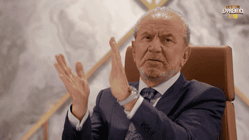 lord alan sugar clapping in a boardroom