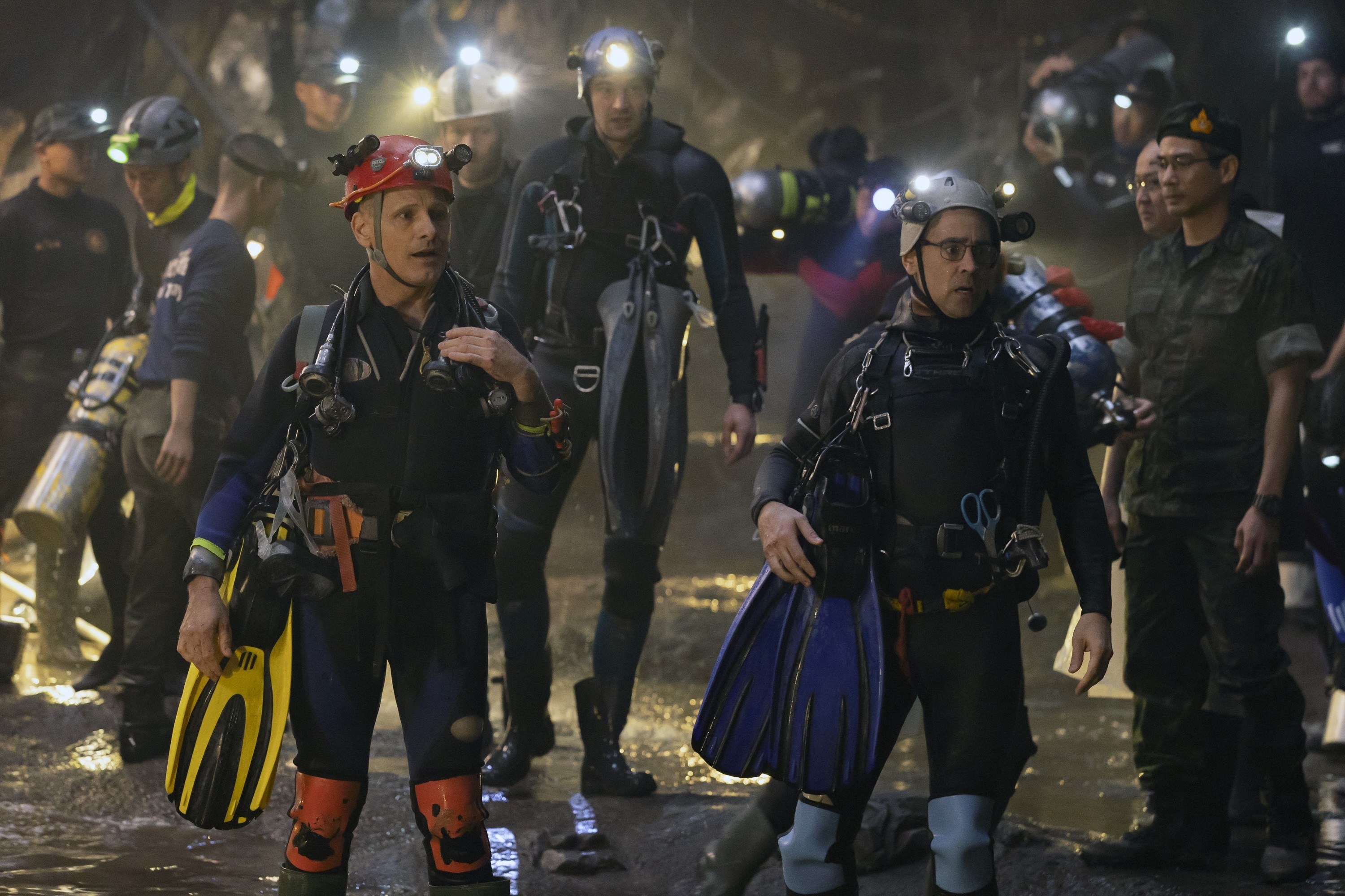 Viggo Mortensen, Joel Egerton, Tom Bateman, Colin Farrell, and Theerapat Sajakul stand in a cave