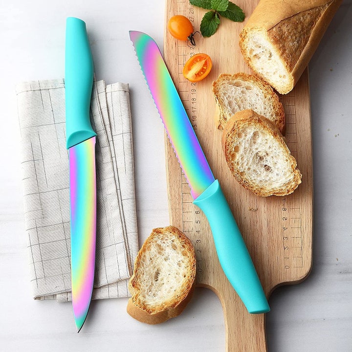 a pair of knives with rainbow-hued blades