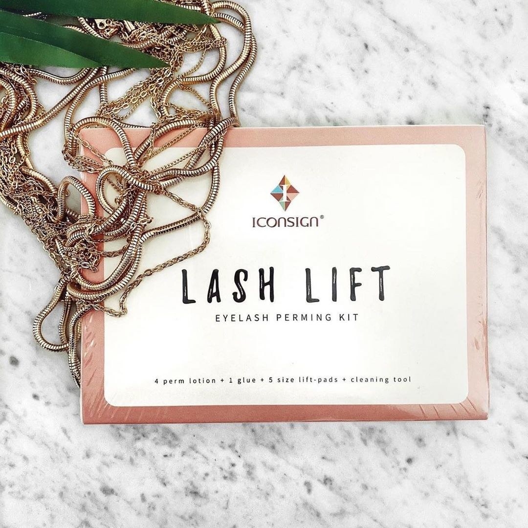 the lash lift kit on a counter with necklaces on it