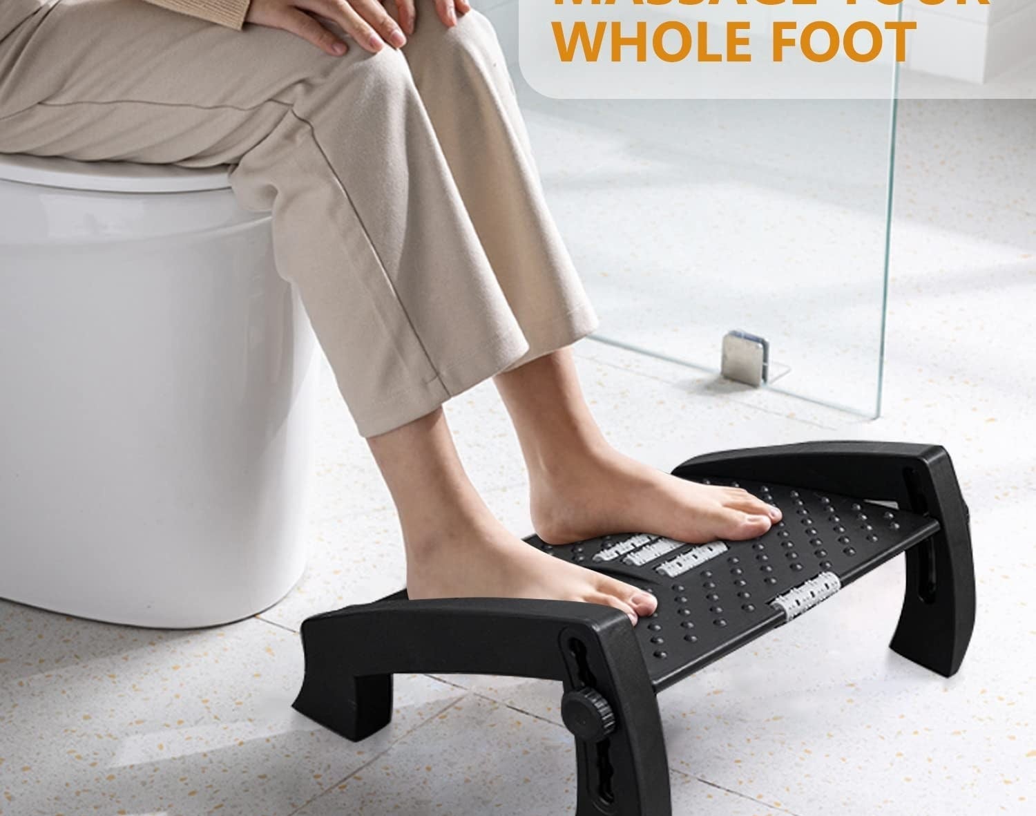 a person propping their feet on the stool with built-in massage rollers