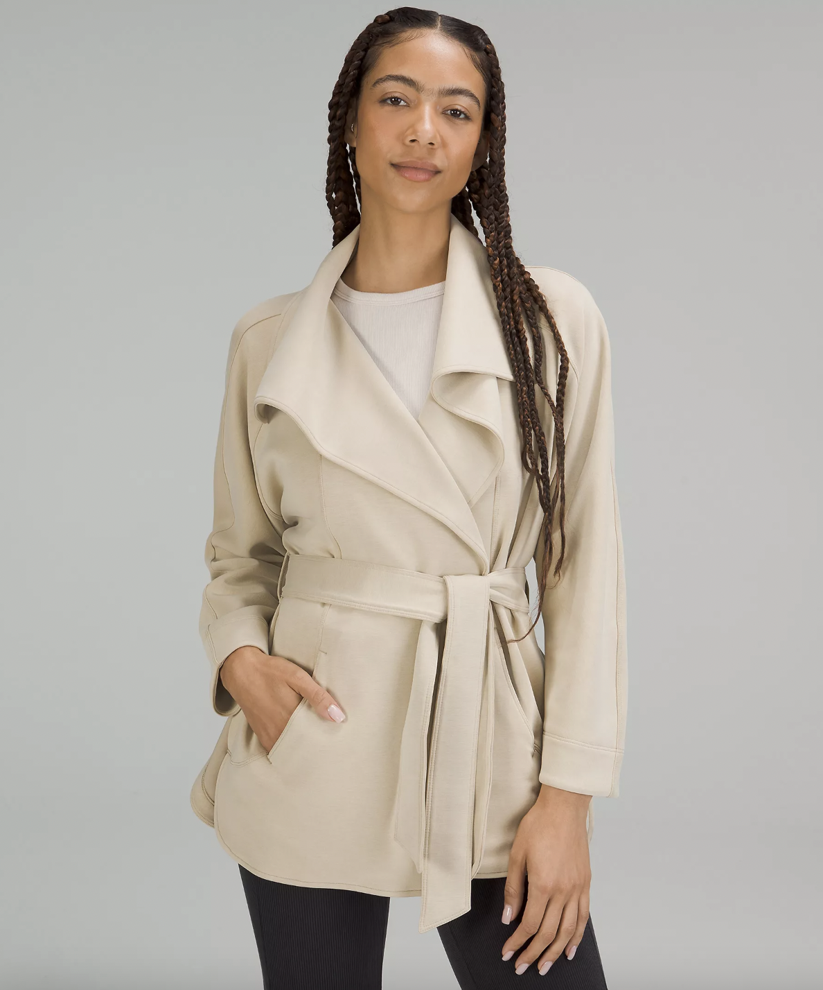 a person wearing the belted wrap cardigan