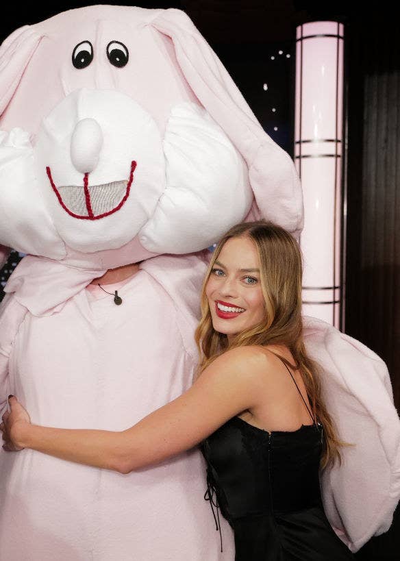 Margot hugging a mascot dressed as a bunny