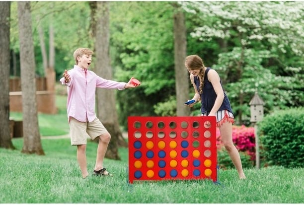 Two kids playing bolaball