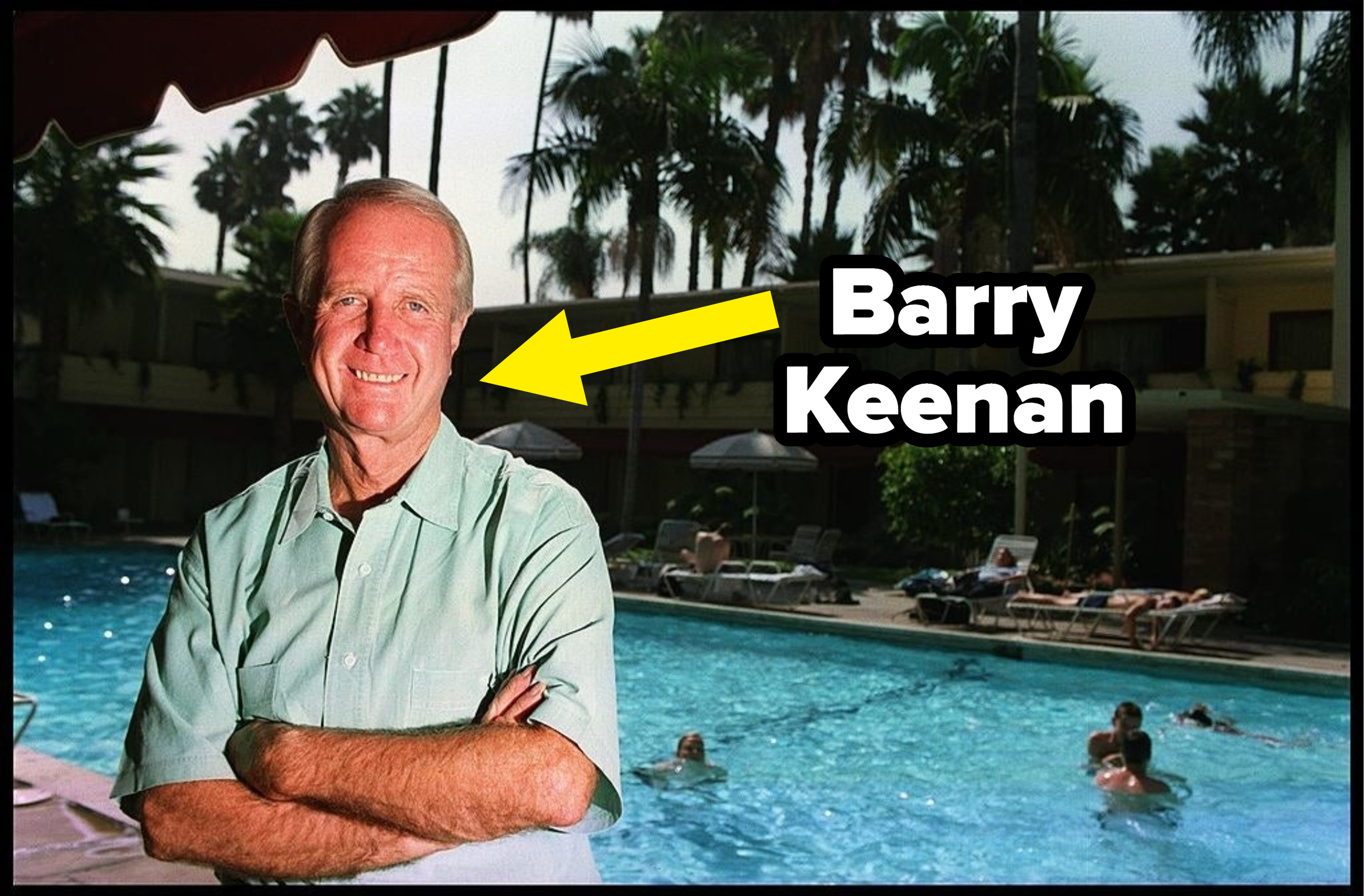 Kennan smiling at the camera outside a pool