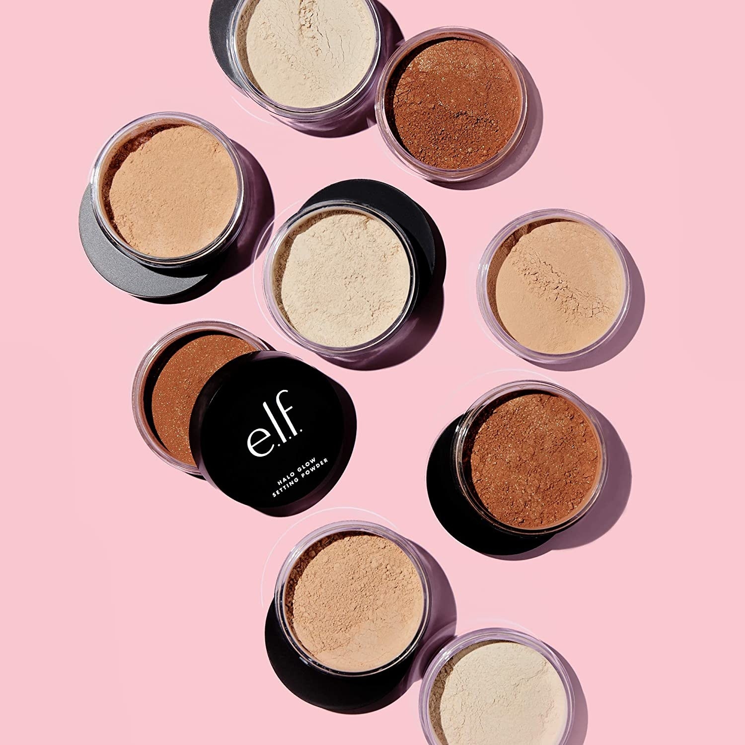 a flatlay of different shades of the elf halo glow setting powder