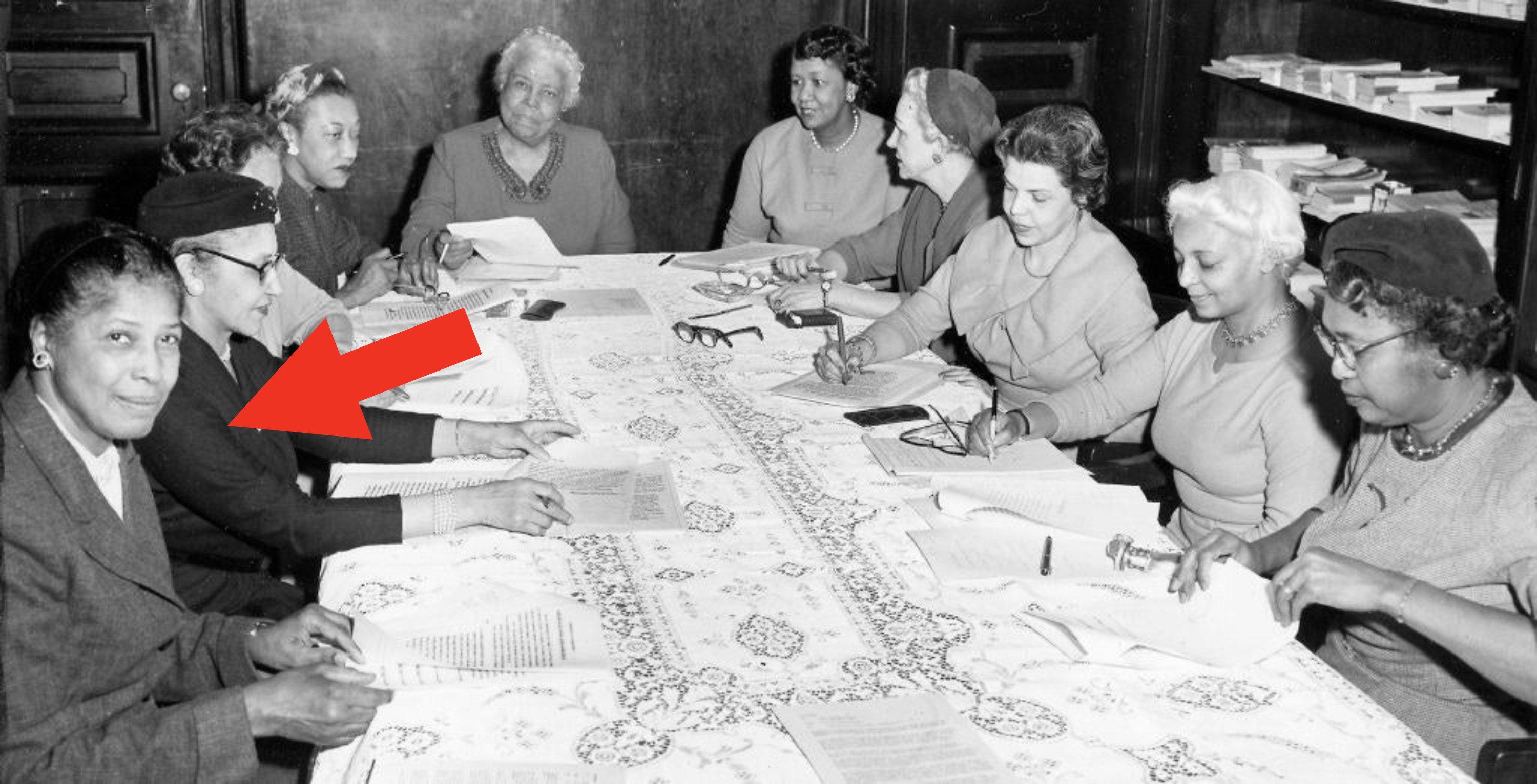 arrow pointing to dorothy sitting at a table full of other women