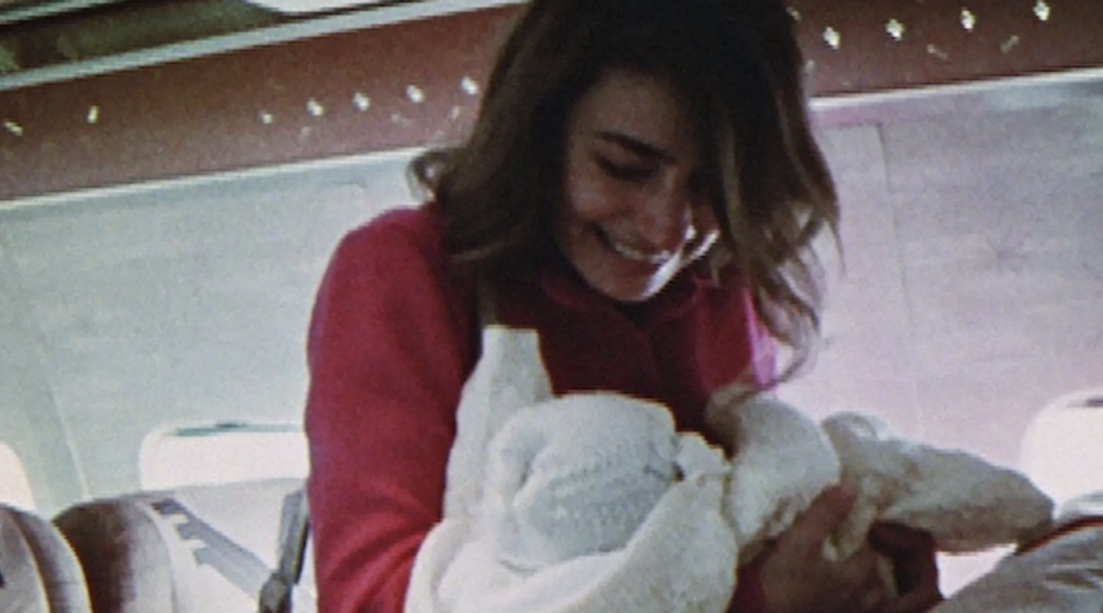 chopra holding her newborn