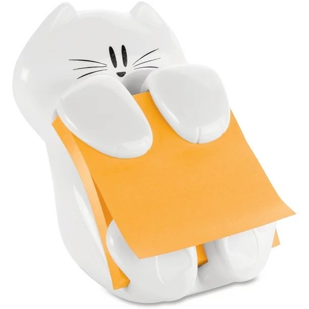 a cat figurine holding an orange set of Post-Its