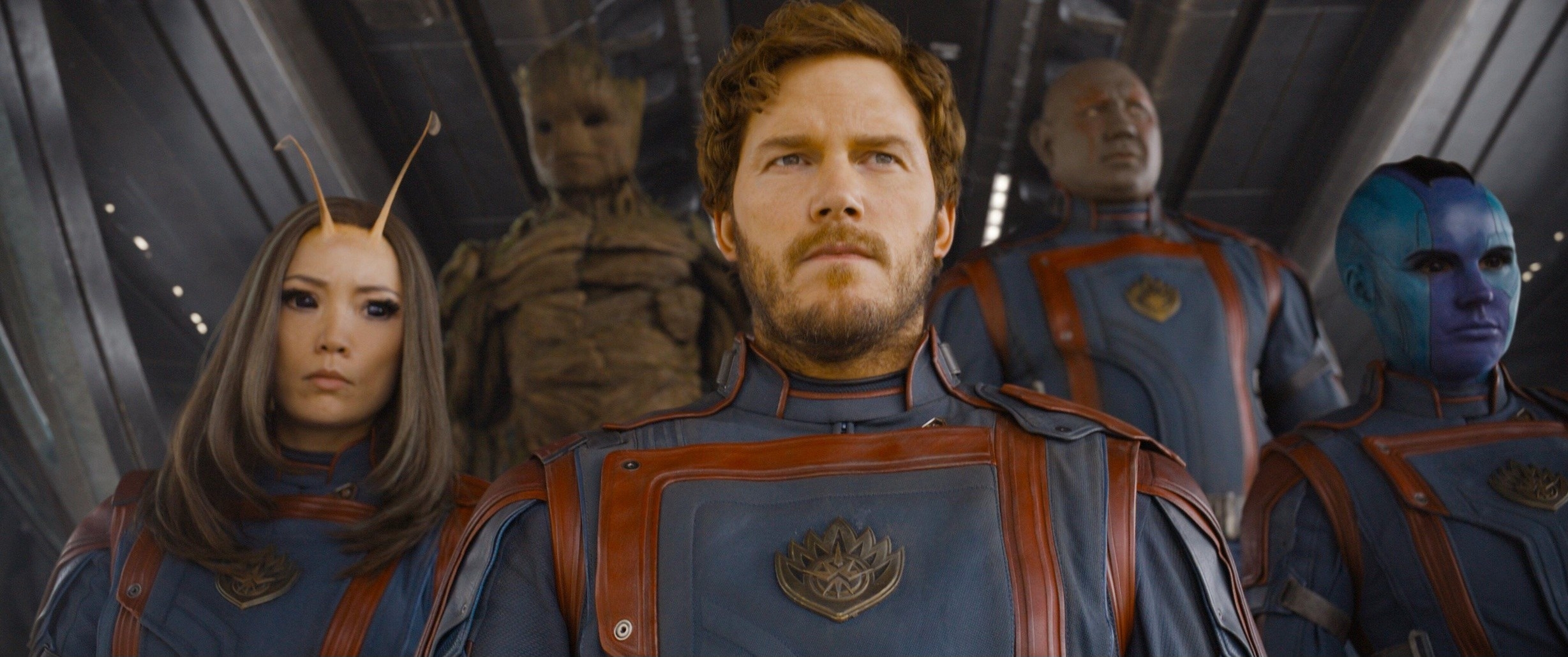 The Guardians of the Galaxy exit a spacecraft in matching outfits