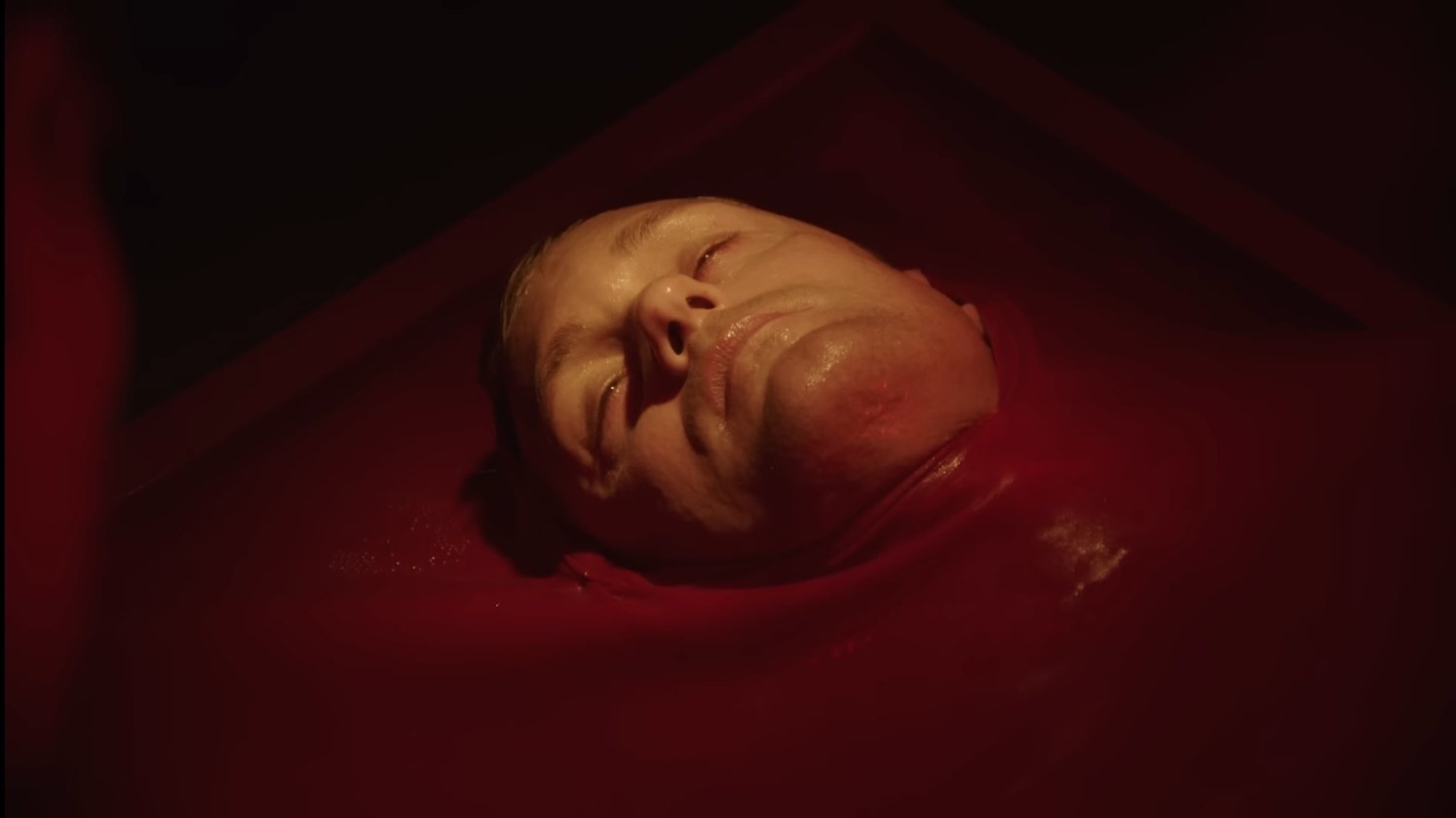 The body of a man is formed in a pool of wax-like goo