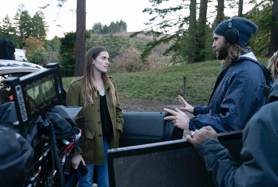 Behind the scenes image of Gerard as he directs Allison out in the woods