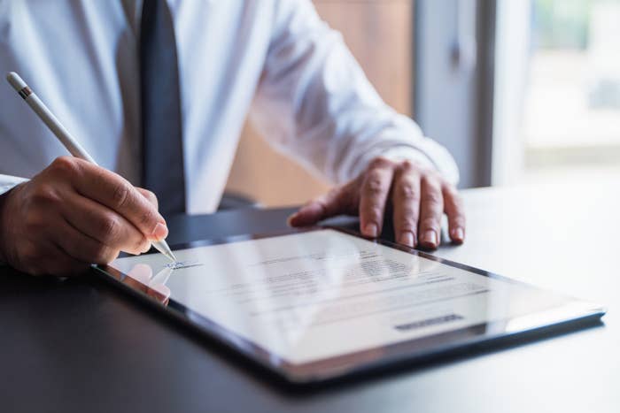 Man signing a contract