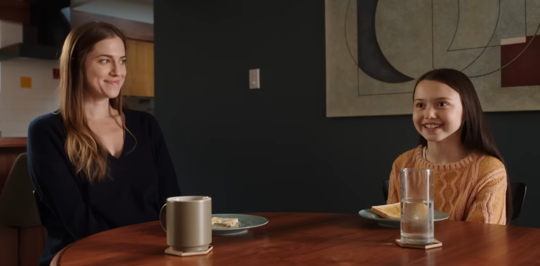 Gemma and Cady sitting at a dining table