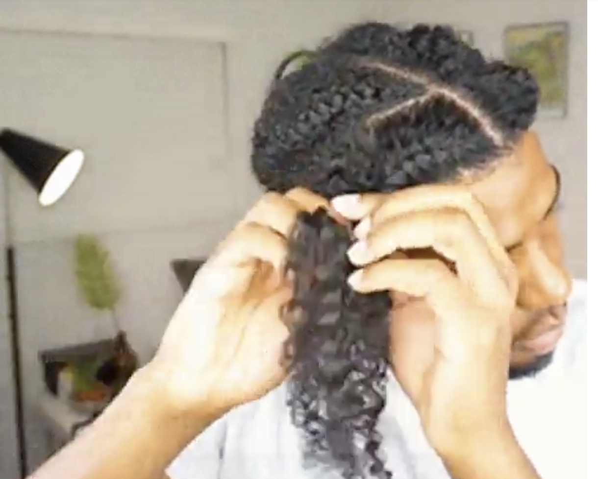 a person twisting their hair