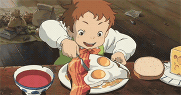 a gif of an animated character chowing down on eggs and bacon