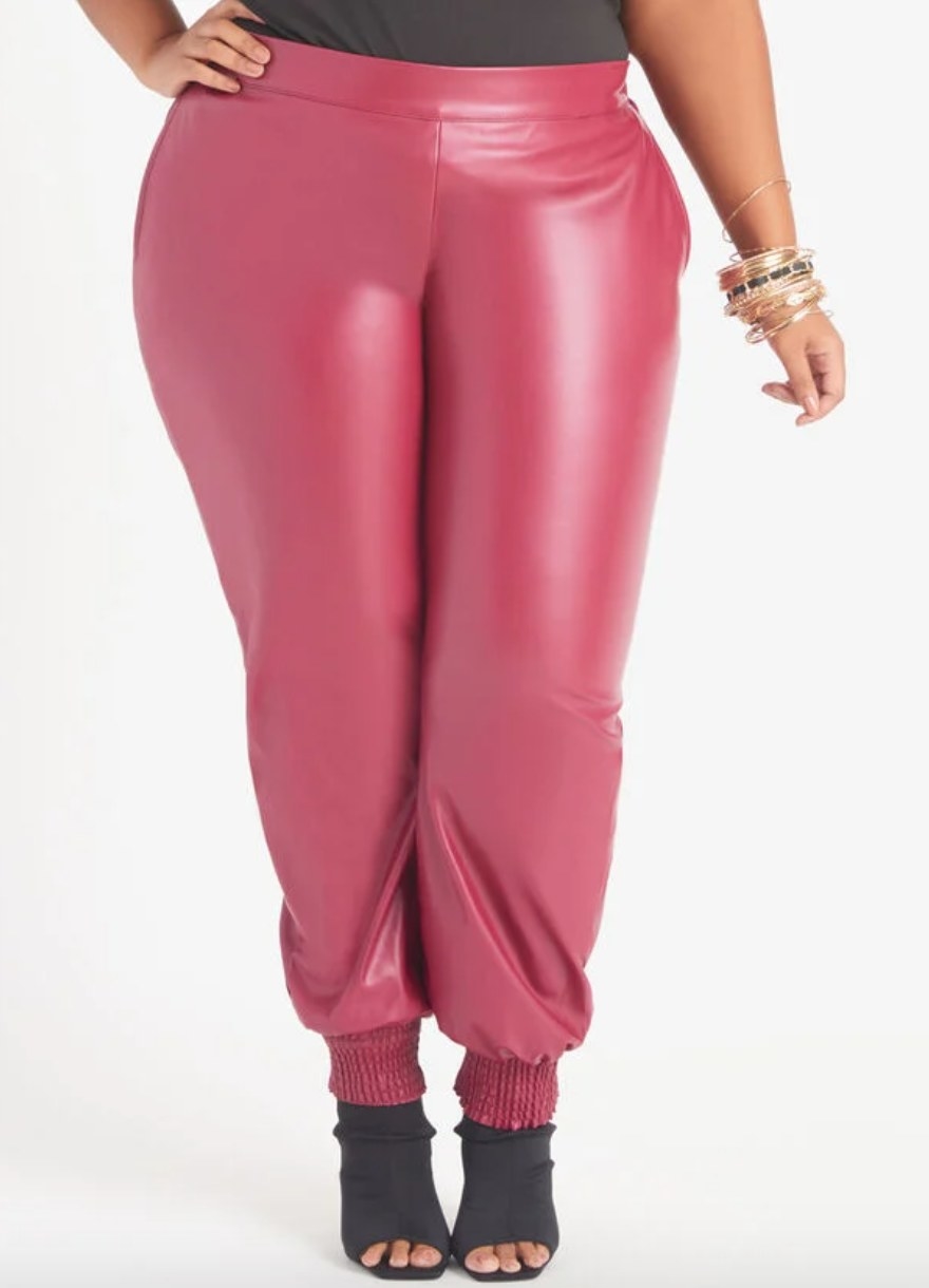 model wearing the pink leather joggers