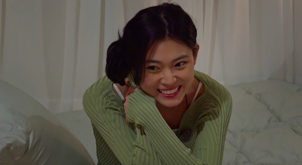 Nadine Lee smiles in a green top