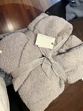 the grey robe wrapped up with a ribbon