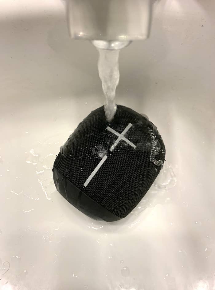 the speaker under a tap with water on it