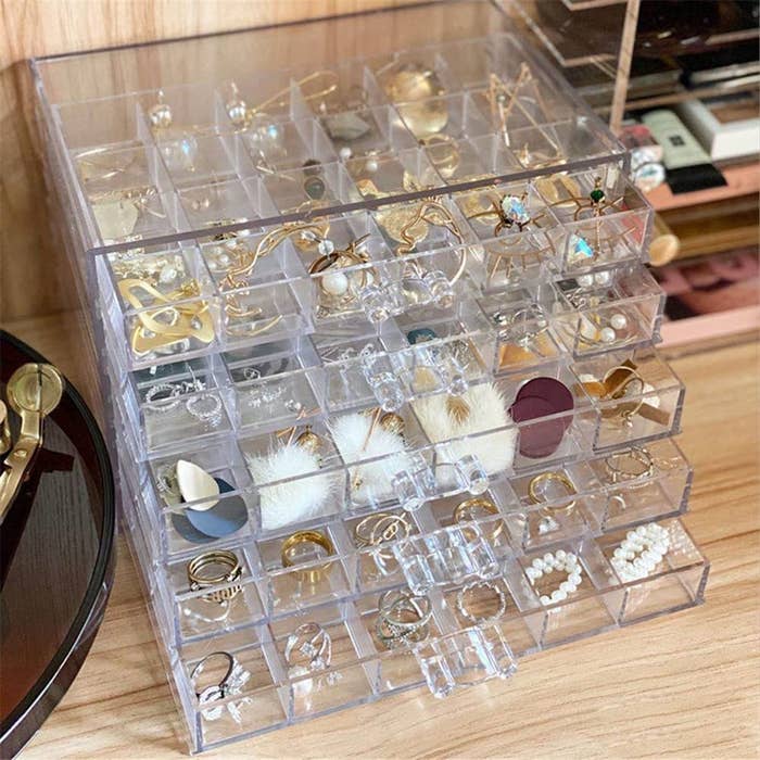 the organizer filled with jewellery on a table